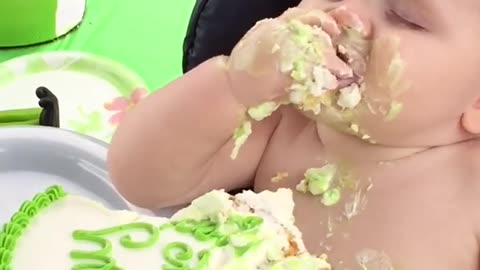 Baby enjoying the cake