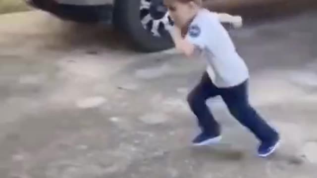 Little kid runs into garage door