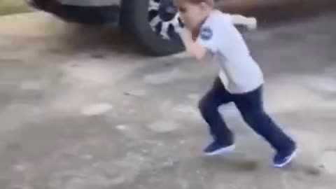 Little kid runs into garage door