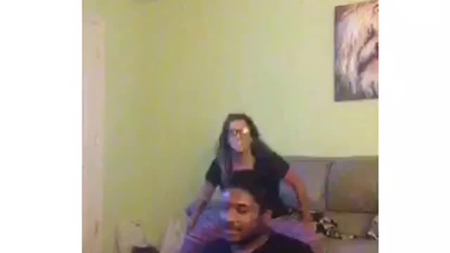 Two friends are dancing and one guy slams head on sofa