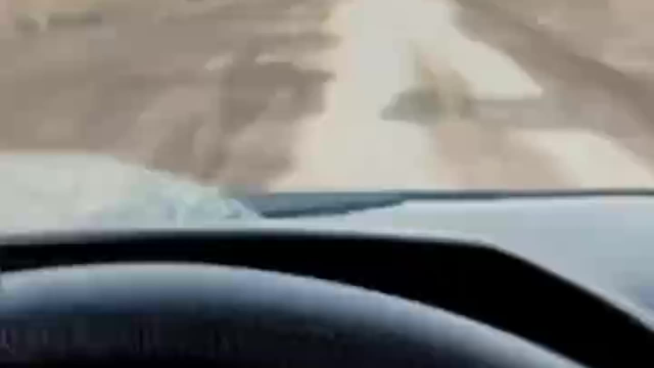 Russian Soldiers Driving By Destroyed Vehicles