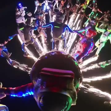 Jumping from sky wearing neon radium dress : fireworks & crackers with skydiving