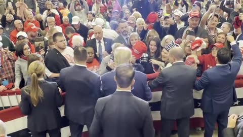 Trump signs hats for supporters in iowa