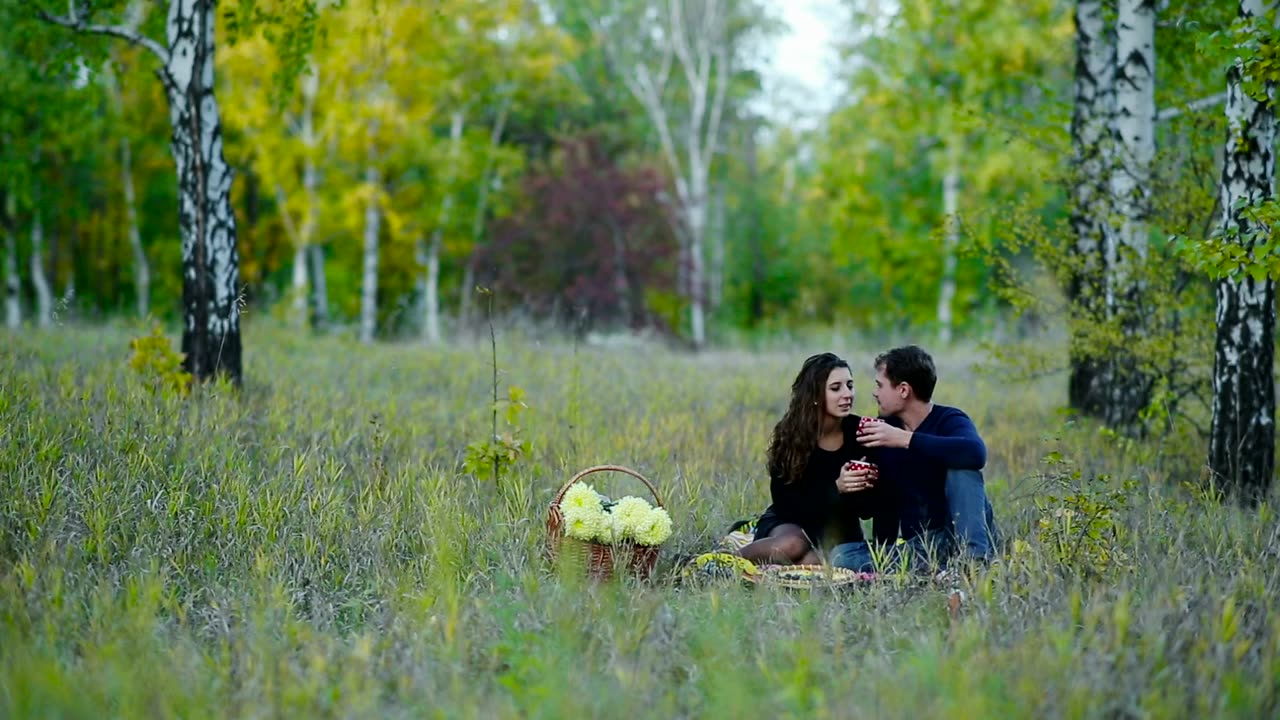 Couple on a picnic in the middle of nature