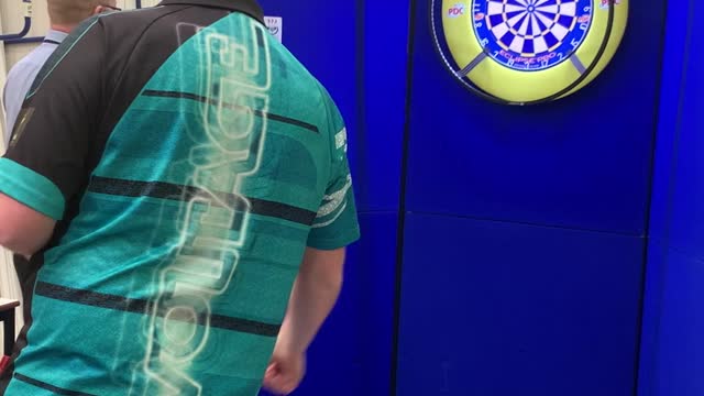 Boy Plays Darts with Professional Player Rob Cross