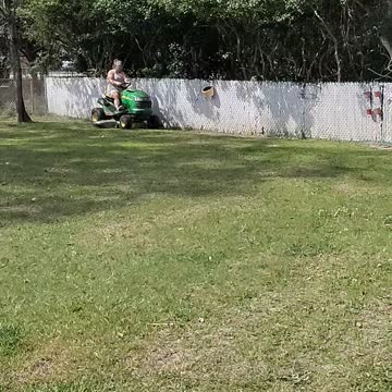 Wife cutting grass