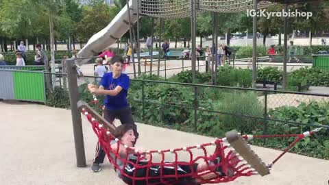 Kid on red hammock flipped face plants