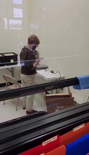 This is an ATF agent illegally photographing a registry of local gun owners