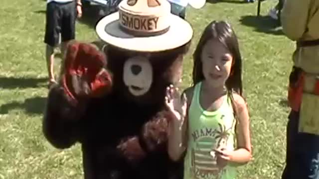 Diane and Smokey The Bear at picnic.