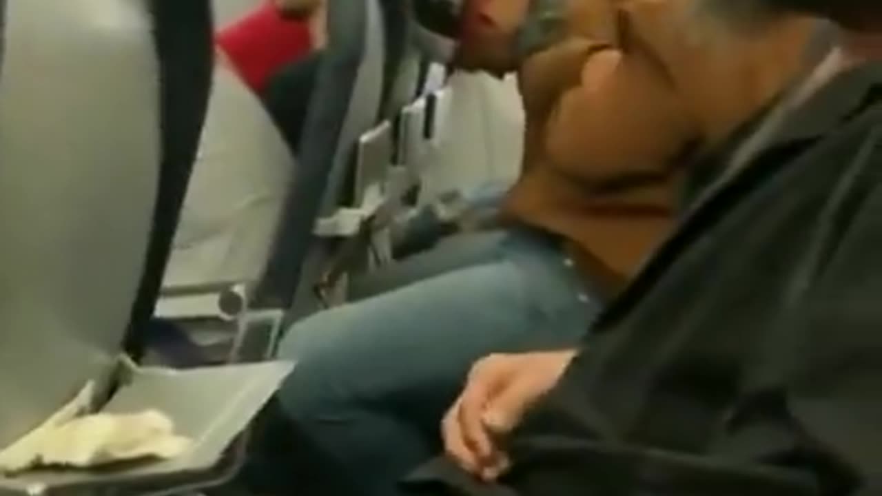 Guy lights up cigarette on a plane and finds out