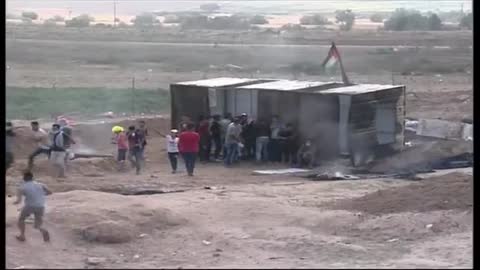 Palestinian demonstrators gather near the Gaza-Israel border