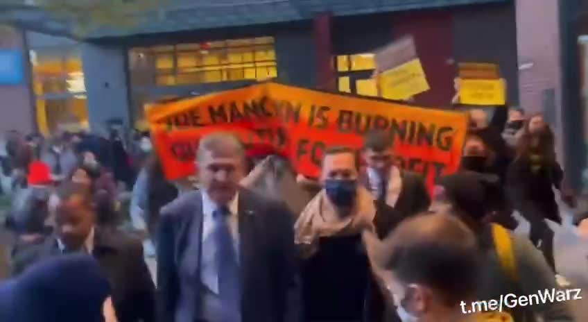 Climate Activists Swarm Senator Manchin Chanting “We want to live” 🤣