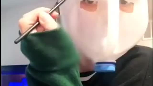 Girl Draws Eyebrows Over Face Shield Made Out of Milk's Plastic Jug