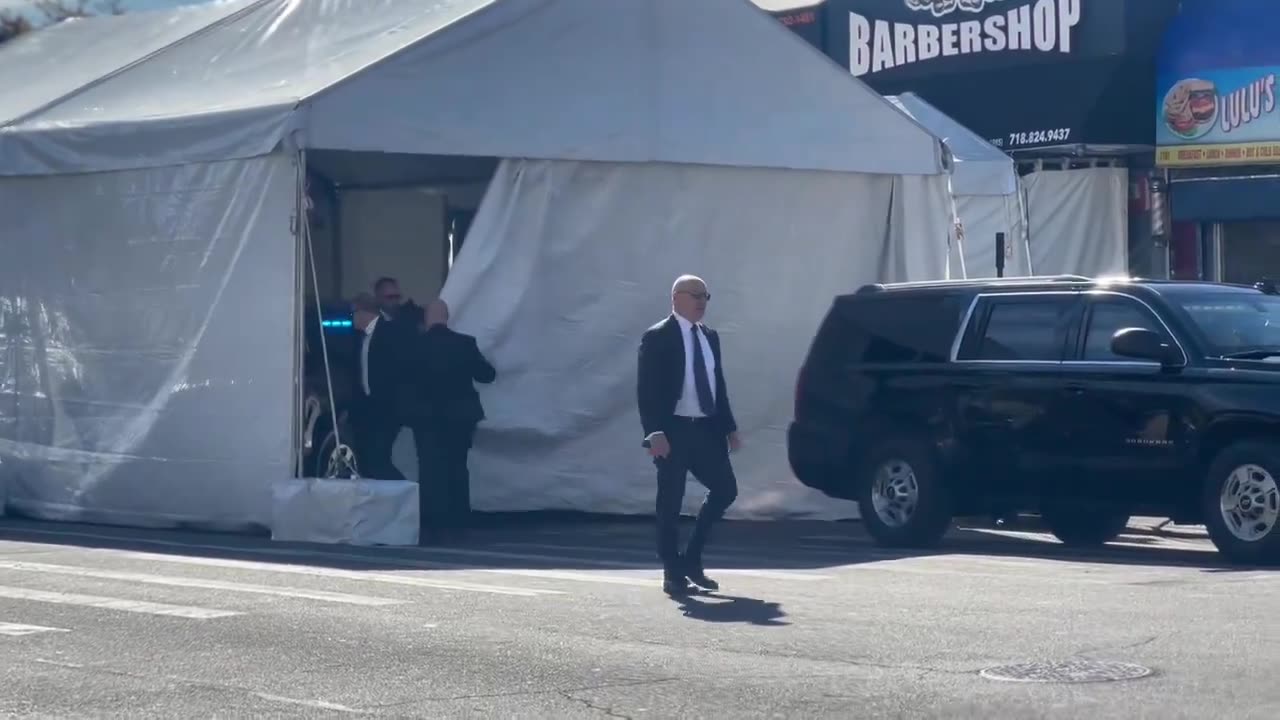 Donald Trump stops at a barber shop in the Bron