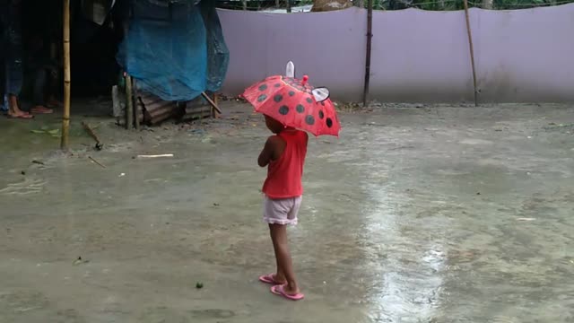 Happiness childhood whith rain!!