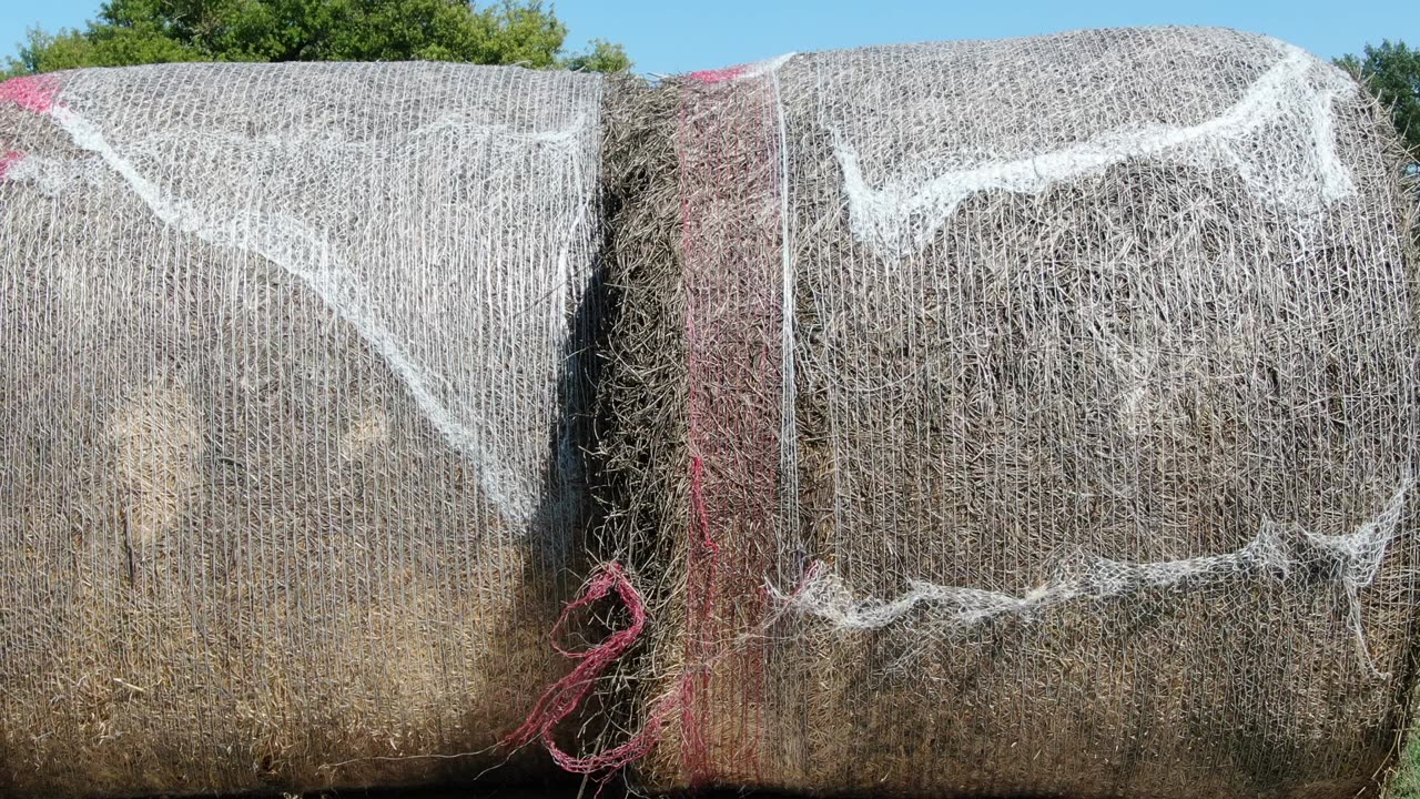 Robert loading 3 closeup of pushing bale