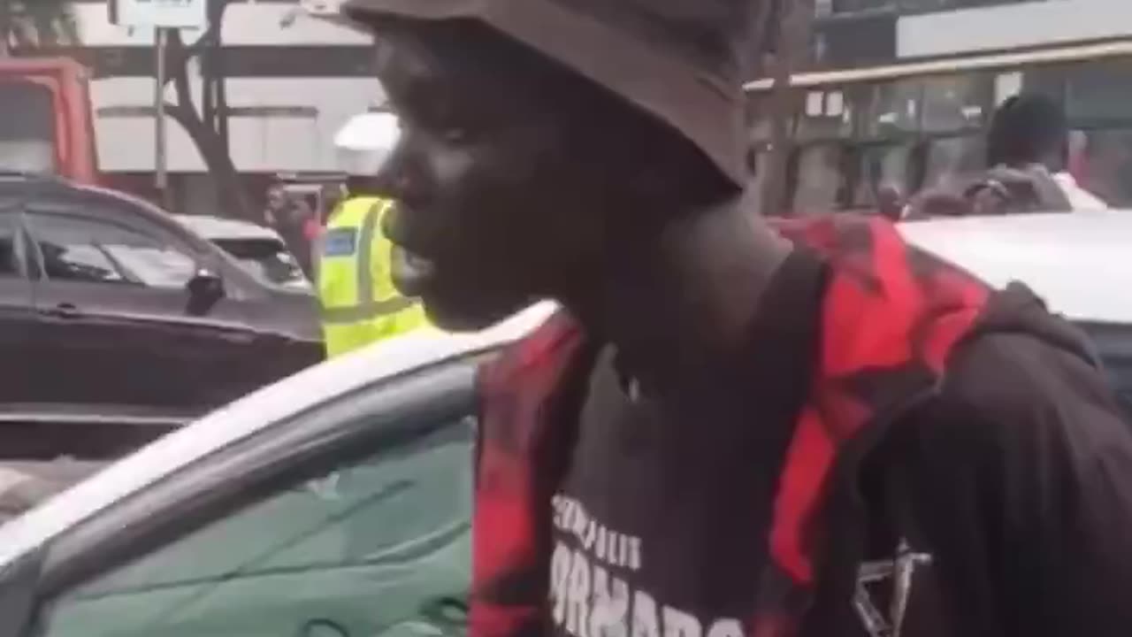 The African seems shocked by what he sees.