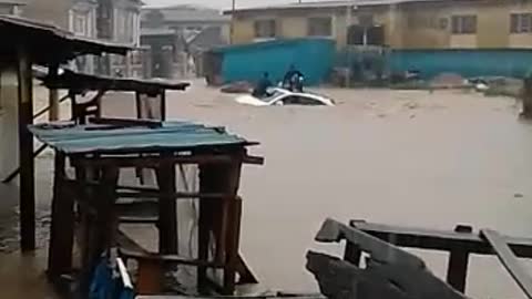 Flood sweeping an SUV AWAY