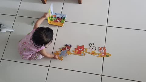 Baby Solves Puzzle