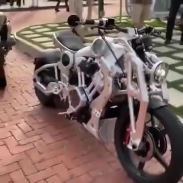 Water powered motor bike generates hydrogen via electrolysis.