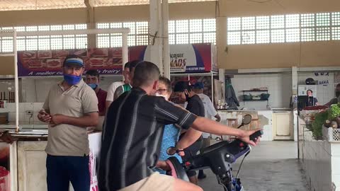 Guy Loses Control of Motor Bike While Showing Off in Meat Market