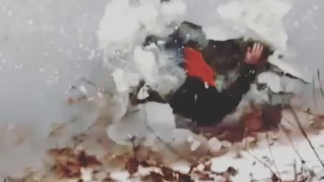 Guy red sled slide frozen lake