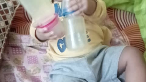 Prinshu playing with 2 empty bottles 😀😀