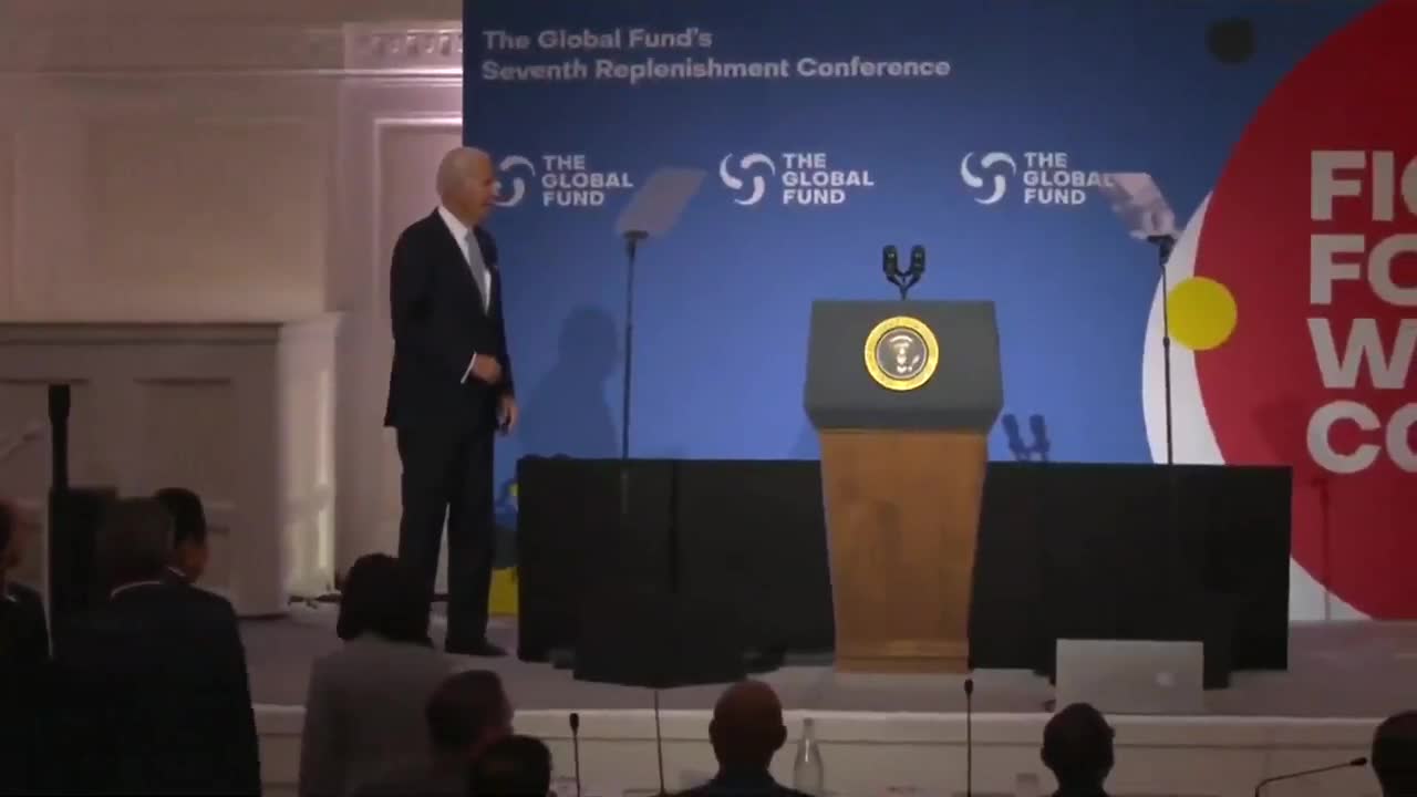 BidAn appears confused on stage at The Global Fund Conference.