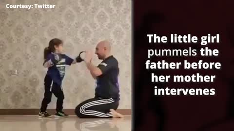 Watch: This little girl pummels her father to victory