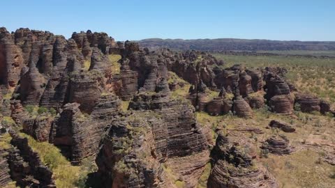 The geologists ignored the heat of burning sand and crumbling rocks