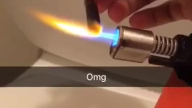 Guy lights his blunt with a blow torch and accidentally sets his hair on fire