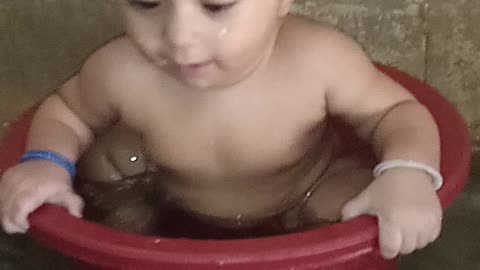 My cute baby is taking bath & enjoying