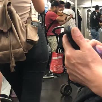 Guy red shirt playing violin subway