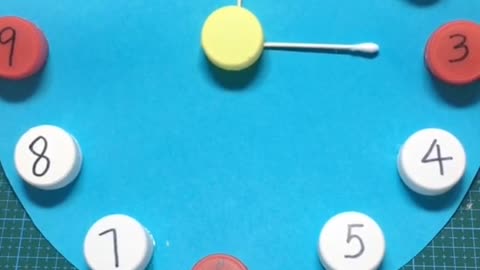 The cap of drinking bottle is used to teach children to recognize the clock