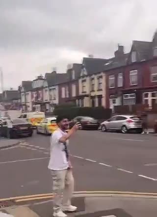 Police run away from migrant mob amid violent unrest in Leeds, England.