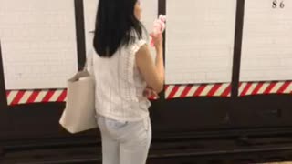 Woman spraying herself with water and air