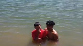 Olioni baptizing Jeff