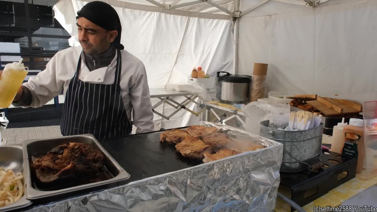 Cooking chicken fillets for Japanese Chicken Katsu. London Street Food