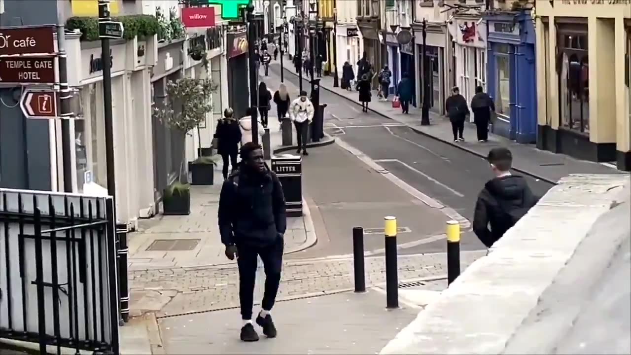 African goes around hassling people in small town Ireland while secretly