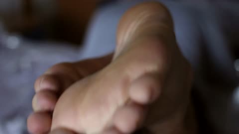 Barefoot Close up soles and dirty white shock