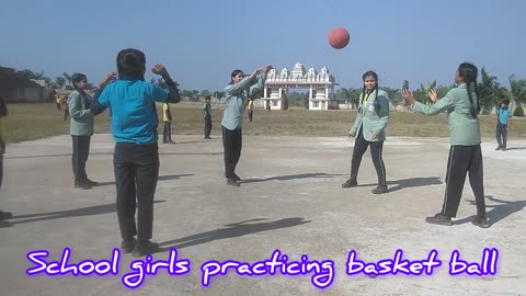 School girls playing basketball