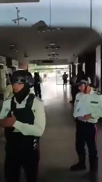 Regional Police Officers, some with Tears in their Eyes, take off their Uniforms