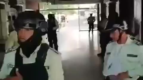Regional Police Officers, some with Tears in their Eyes, take off their Uniforms
