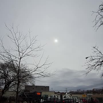 A covering(fake couds) in the atmosphere with a weak area showing the sun