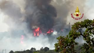 Firefighters battle raging wildfires in northern Italy