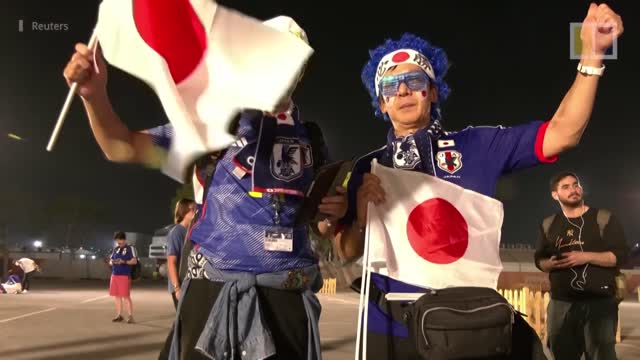 Japanese fans celebrate their team’s stunning World Cup upset victory over Germany