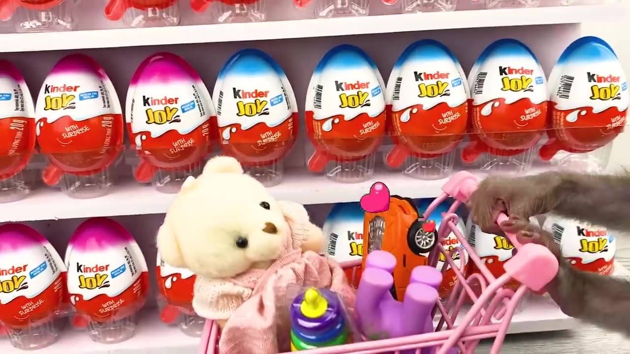 Monkey Baby Bon Bon doing shopping in Car Toy store and eat Kinder Joy Egg chocolate with puppy