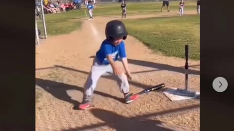 TRY NOT TO LAUGH. T BALL SLUGGER WORKS HIS MOVES AT BAT