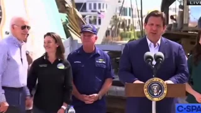 Grinning Joe Biden Creeps on Female FEMA Official as Governor DeSantis is Speaking