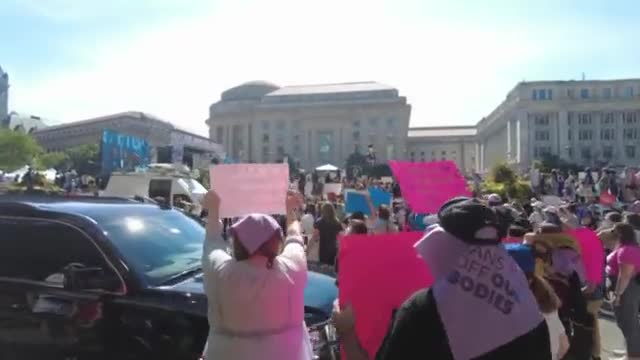 Participants at the "Rally for Abortion Rights" sing the “Women Warrior” song